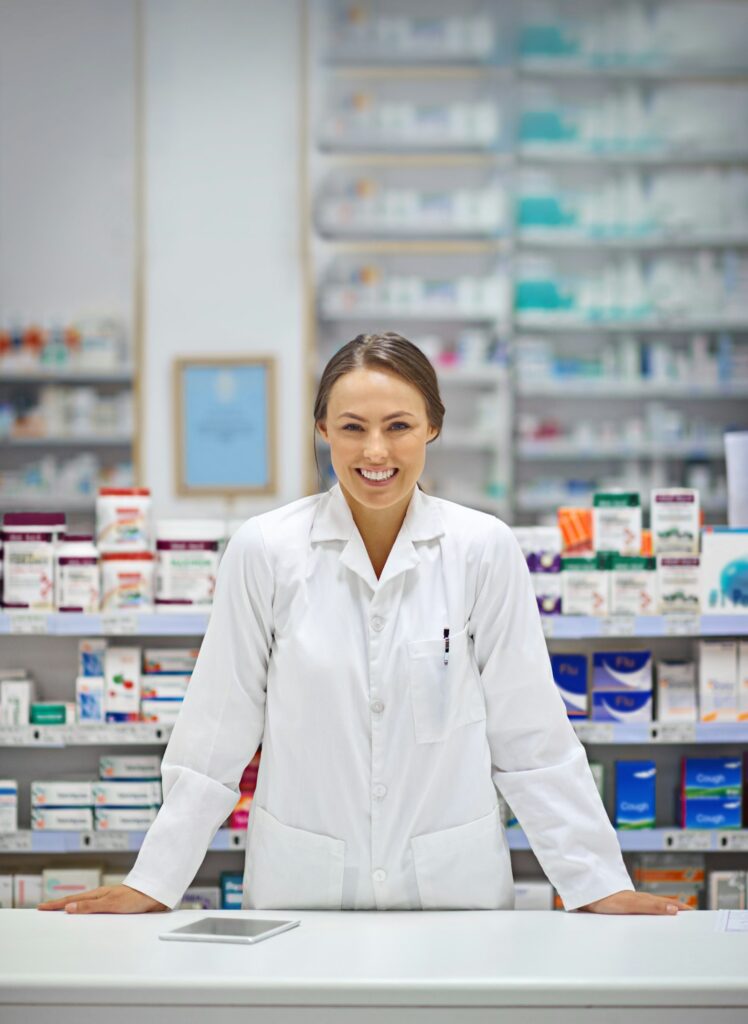 Portrait of an attractive young pharmacist standing at the prescription counter